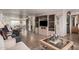 Spacious living room with wood floors, stylish furniture, and open layout at 506 S 81St Pl, Mesa, AZ 85208