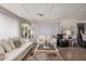 Bright living room with comfortable sofas, a coffee table, and a mirrored wall, creating a welcoming space at 506 S 81St Pl, Mesa, AZ 85208