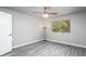 Bright bedroom offering sleek floors, a modern ceiling fan, and a sunny window view at 540 Leisure World --, Mesa, AZ 85206