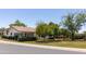 Beautiful single-story home with a well-maintained lawn, mature trees, and a tiled roof at 540 Leisure World --, Mesa, AZ 85206
