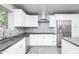 Bright kitchen featuring white cabinets, stainless steel appliances, gray countertops, and a subway tile backsplash at 540 Leisure World --, Mesa, AZ 85206