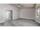 Spacious living room with gray flooring, neutral paint, ceiling fan, and a large window at 540 Leisure World --, Mesa, AZ 85206
