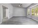 A bright, expansive living area featuring neutral walls, gray flooring, and large windows for ample light at 540 Leisure World --, Mesa, AZ 85206