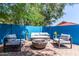 Inviting outdoor patio featuring stylish seating, a fire pit, and lush greenery, perfect for relaxing and entertaining at 6325 E Helm Dr, Scottsdale, AZ 85254