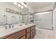 This bathroom features a tub/shower combo and double sinks at 6325 E Helm Dr, Scottsdale, AZ 85254