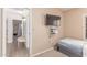 This bedroom features neutral decor and a mounted tv at 6325 E Helm Dr, Scottsdale, AZ 85254