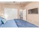 This bedroom features neutral decor and a closet with sliding doors at 6325 E Helm Dr, Scottsdale, AZ 85254