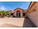 Charming home with desert landscaping, a well-manicured lawn, and a spacious driveway at 6325 E Helm Dr, Scottsdale, AZ 85254