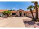 Charming single-story home with desert landscaping, tile roof, and a spacious driveway at 6325 E Helm Dr, Scottsdale, AZ 85254