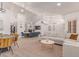 Spacious living area adjacent to dining, featuring modern furnishings and an open layout at 6325 E Helm Dr, Scottsdale, AZ 85254