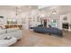 Spacious living room featuring high ceilings, a fireplace, and a modern aesthetic at 6325 E Helm Dr, Scottsdale, AZ 85254