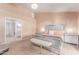 This main bedroom features an upholstered bed, neutral decor, and a vaulted ceiling at 6325 E Helm Dr, Scottsdale, AZ 85254
