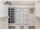 This walk-in closet features ample shelving and built-in organizer at 6325 E Helm Dr, Scottsdale, AZ 85254