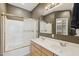 Bathroom with double sinks, gold trimmed shower, and ample storage at 6425 S Kimberlee Way, Chandler, AZ 85249