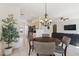 Bright dining space next to the kitchen and living room, illuminated by a chandelier at 6425 S Kimberlee Way, Chandler, AZ 85249