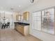 Eat-in kitchen area featuring stainless steel appliances, window with a view, and tile flooring at 6425 S Kimberlee Way, Chandler, AZ 85249
