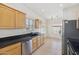 Functional kitchen featuring a stainless steel dishwasher and a practical layout for cooking at 6425 S Kimberlee Way, Chandler, AZ 85249