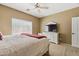 Well-lit main bedroom featuring neutral decor and carpeted floors at 6425 S Kimberlee Way, Chandler, AZ 85249