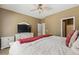Relaxing main bedroom features a TV, neutral colors, and carpeted floors at 6425 S Kimberlee Way, Chandler, AZ 85249