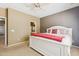 Bright main bedroom featuring a large bed, neutral decor, and an en-suite bathroom at 6425 S Kimberlee Way, Chandler, AZ 85249