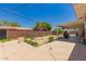 Expansive backyard featuring a patio, block wall, and a mix of plants and hardscape at 6541 N 41St Ave, Phoenix, AZ 85019