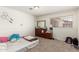 Spacious bedroom with a dresser, natural light, and carpeting at 6541 N 41St Ave, Phoenix, AZ 85019