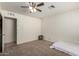 Clean bedroom offering carpeted floors, a ceiling fan, and neutral paint at 6541 N 41St Ave, Phoenix, AZ 85019