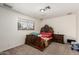 Cozy bedroom featuring a unique, ornate bed frame and natural light from a window at 6541 N 41St Ave, Phoenix, AZ 85019