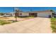 Exterior view of a single-story home with a long driveway and a basketball hoop in the front yard at 6541 N 41St Ave, Phoenix, AZ 85019