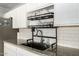 Well-lit kitchen with modern sink fixtures, stainless steel basin, and subway tile backsplash at 6541 N 41St Ave, Phoenix, AZ 85019