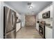 Modern kitchen showcasing stainless steel appliances, white cabinets, granite countertops, and sleek flooring at 6541 N 41St Ave, Phoenix, AZ 85019