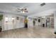 Spacious living area with light wood floors, neutral walls, and seamless transition to the kitchen at 6541 N 41St Ave, Phoenix, AZ 85019