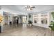 Open-concept living room with light wood floors and large windows with stylish curtains and decor at 6541 N 41St Ave, Phoenix, AZ 85019