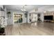 Bright and open floor plan showcasing the living room, dining area, and sliding glass doors to the patio at 6541 N 41St Ave, Phoenix, AZ 85019