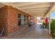 Brick covered patio and home featuring iron bars and an open space at 6541 N 41St Ave, Phoenix, AZ 85019