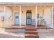 Comfortable back porch with seating for outdoor relaxation with beautiful desert sunshine shining on this home at 711 E Mckinley St, Phoenix, AZ 85006