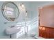 Bathroom with pedestal sink, medicine cabinet, and vintage charm at 711 E Mckinley St, Phoenix, AZ 85006