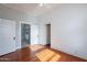 Spacious bedroom with hardwood floors and multiple doors at 711 E Mckinley St, Phoenix, AZ 85006
