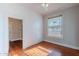 Inviting bedroom with hardwood floors, a ceiling fan, and plenty of natural light at 711 E Mckinley St, Phoenix, AZ 85006