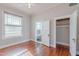 Bedroom featuring hardwood floors, and doors leading to the bathroom and closet at 711 E Mckinley St, Phoenix, AZ 85006