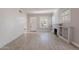 Expansive living room showcasing light gray walls, wood flooring, and a fireplace feature at 711 E Mckinley St, Phoenix, AZ 85006