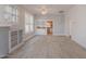 Spacious living room with fireplace and adjacent kitchen view, showcasing an open floor plan at 711 E Mckinley St, Phoenix, AZ 85006