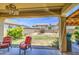 Backyard features covered patio, seating, fire pit, landscaping, and block fence for privacy at 742 W Agrarian Hills Dr, San Tan Valley, AZ 85143