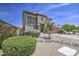 Two-story home featuring desert landscaping, stone accents, neutral paint, and a covered front porch entry at 742 W Agrarian Hills Dr, San Tan Valley, AZ 85143