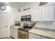 Bright, well-equipped kitchen with stainless steel appliances, granite countertops, and plenty of white cabinet storage at 742 W Agrarian Hills Dr, San Tan Valley, AZ 85143