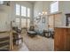 Bright living room features tall ceilings, an open staircase, and neutral-toned furniture and décor at 742 W Agrarian Hills Dr, San Tan Valley, AZ 85143