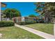 Exterior of a home with well-manicured landscaping, lawn, bushes and trees at 7740 E Heatherbrae Ave # 3, Scottsdale, AZ 85251