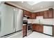 Modern kitchen features stainless steel appliances, wood cabinets, and a bright, clean aesthetic at 7740 E Heatherbrae Ave # 3, Scottsdale, AZ 85251