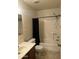 Bathroom with a toilet, shower-tub combination, vanity, mirror, and plumbing fixtures at 8155 W Desert Cove Ave, Peoria, AZ 85345