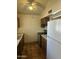 Kitchen featuring a ceiling fan, dark cabinets, tile flooring and white appliances at 8155 W Desert Cove Ave, Peoria, AZ 85345